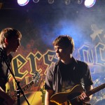 Guitarists Mark Ronning and Ryan Dugan share a few words before their set begins