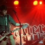 Guitarist Mark Ronning tunes his guitar before starting the next song