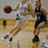 Erin McGinnley penetrates the basket for a shot.
