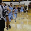 The team celebrates after Senior Zach Schneider knocked down the ball. Photo By Jake Crandall