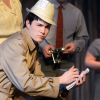 Senior Max Hofmeister plays a reporter and is in the chorus