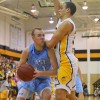 Senior Zach Schnieder is guarded tightly by a West player. Photo by Maddie Schoemann