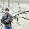 Sophomore Will Oakley attempts to carry wood back to his fire with one arm. Photo by AnneMarie Oakley
