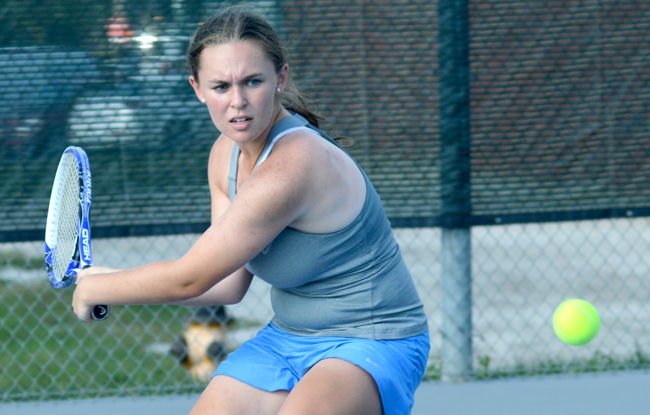 Sophomore Emily Chisholm gets ready to hit the ball in her match with ...