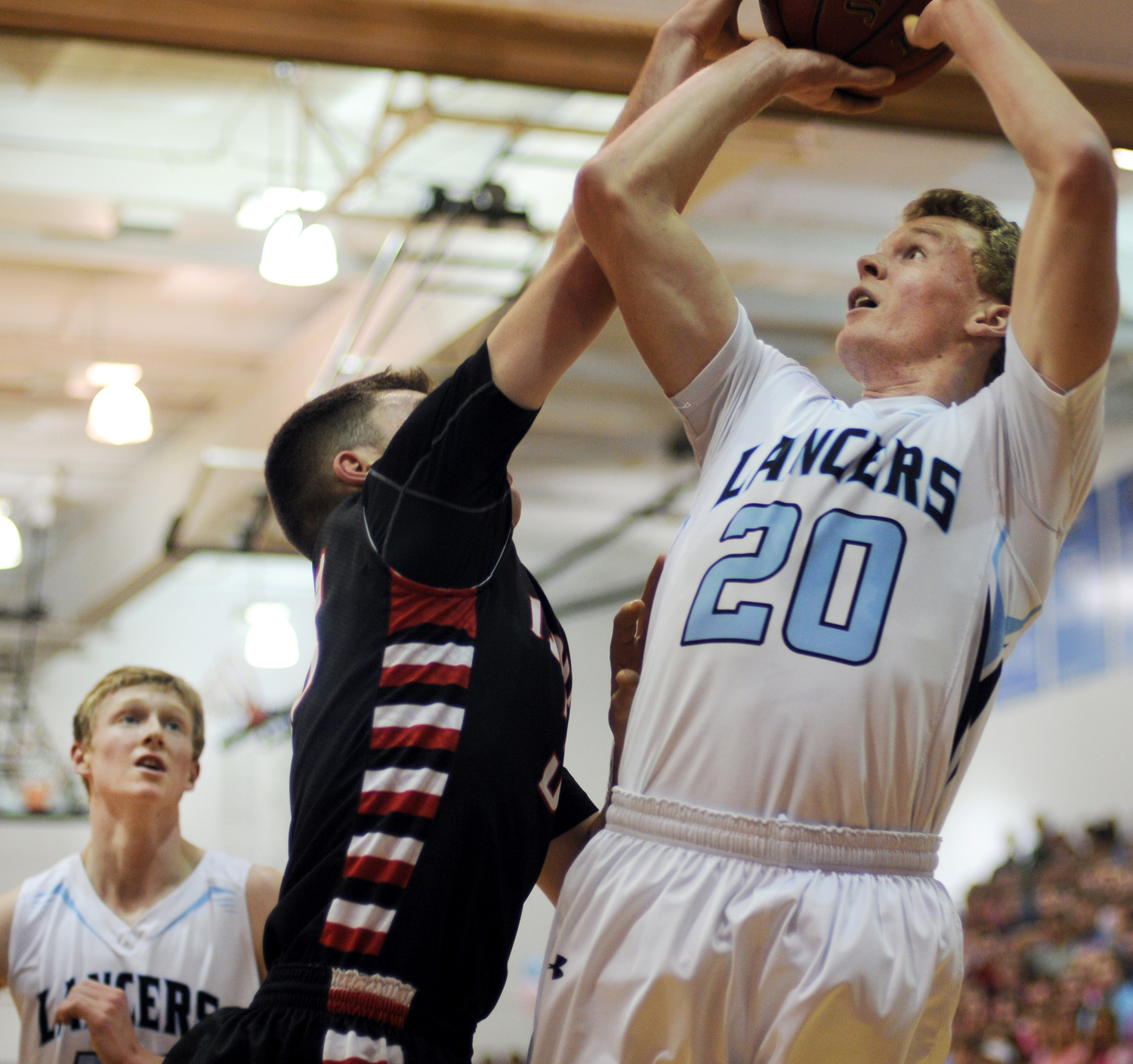 Senior Colin Burns shoots. Photo by Mckenzie Swanson | The Harbinger Online