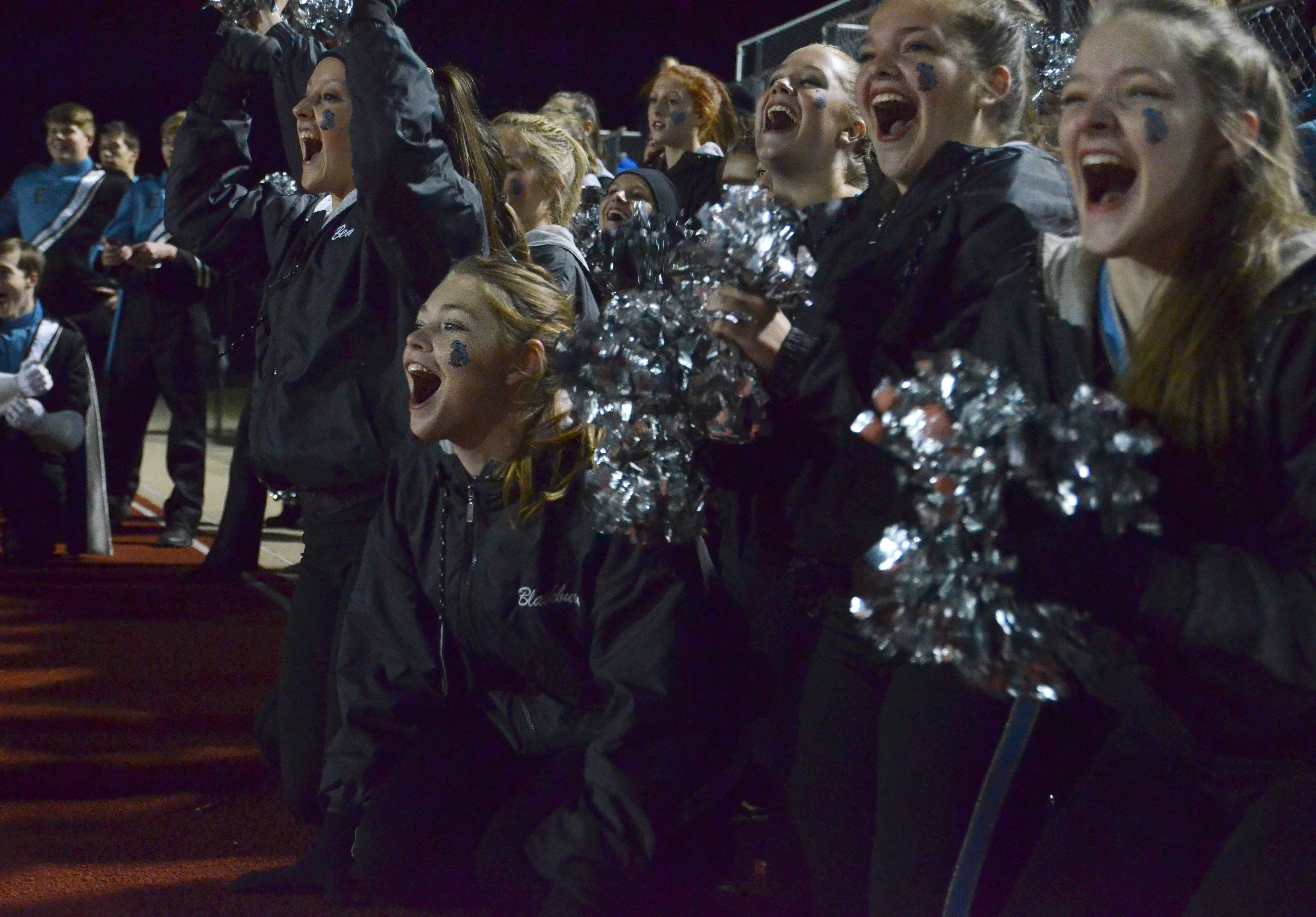 Lancer Dancers cheer on the drum line during their performance. Photo ...