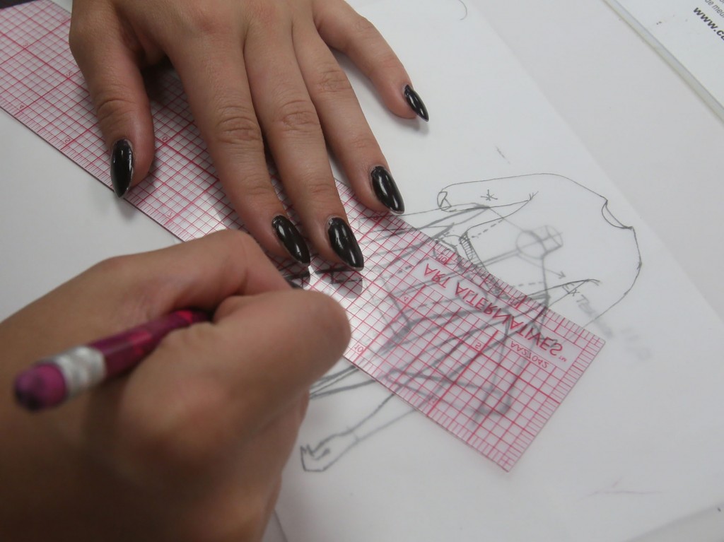 Allyson Kramer works on a project in the Fashion Visuals lab at Kent State University on April 20, 2015, in Kent, Ohio. High school students interested in a fashion industry career are the focus of the week-long Summer Fashion Academy set for June 14-20 at the school. (Michael Chritton/Akron Beacon Journal/TNS)