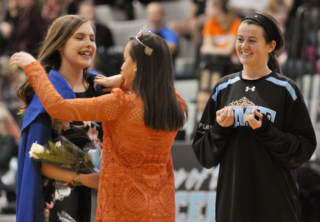Junior Katie Hise smiles as senior Ellie Cook is announced Sweetheart Queen. Photo by Grace Goldman