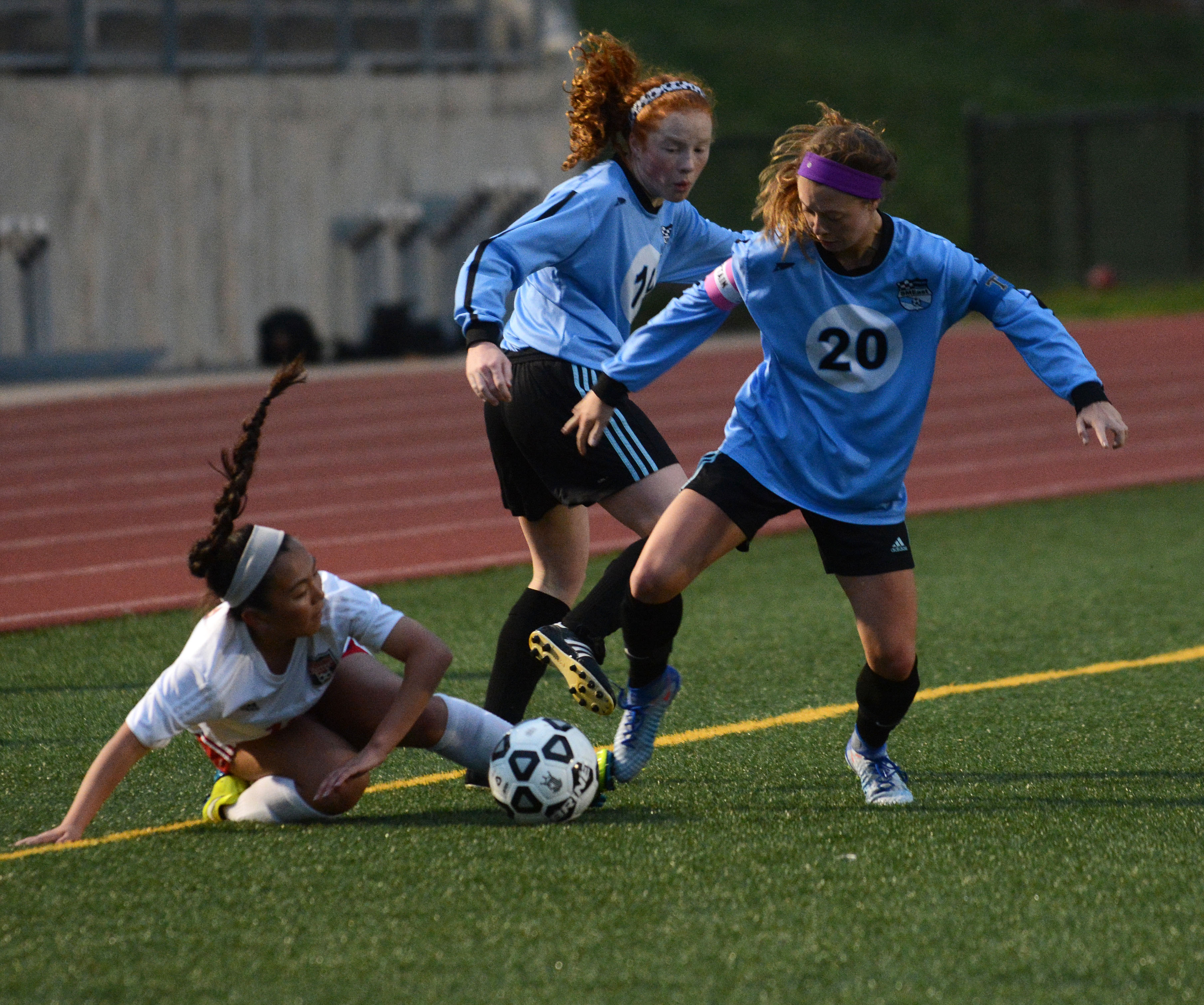 Senior Josie Clough and freshman Emma Burden work together to get ...