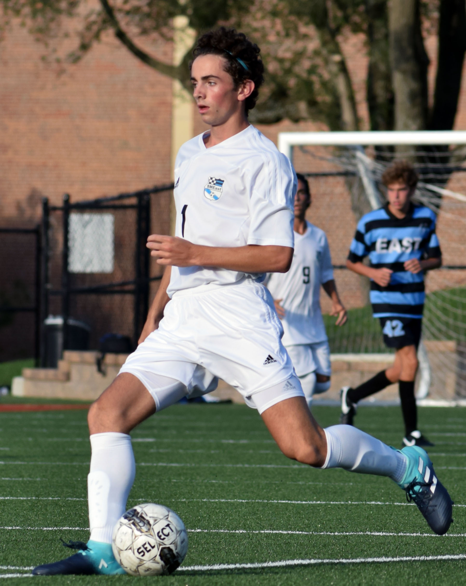 Sophomore TJ Libeer looks down the line for a pass. Photo by Audrey ...