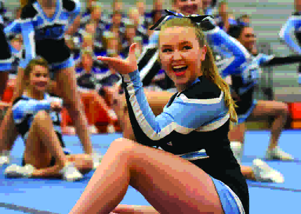 Junior Holly Frigon strikes a pose at the end of the routinue. Photo by Katherine Odell