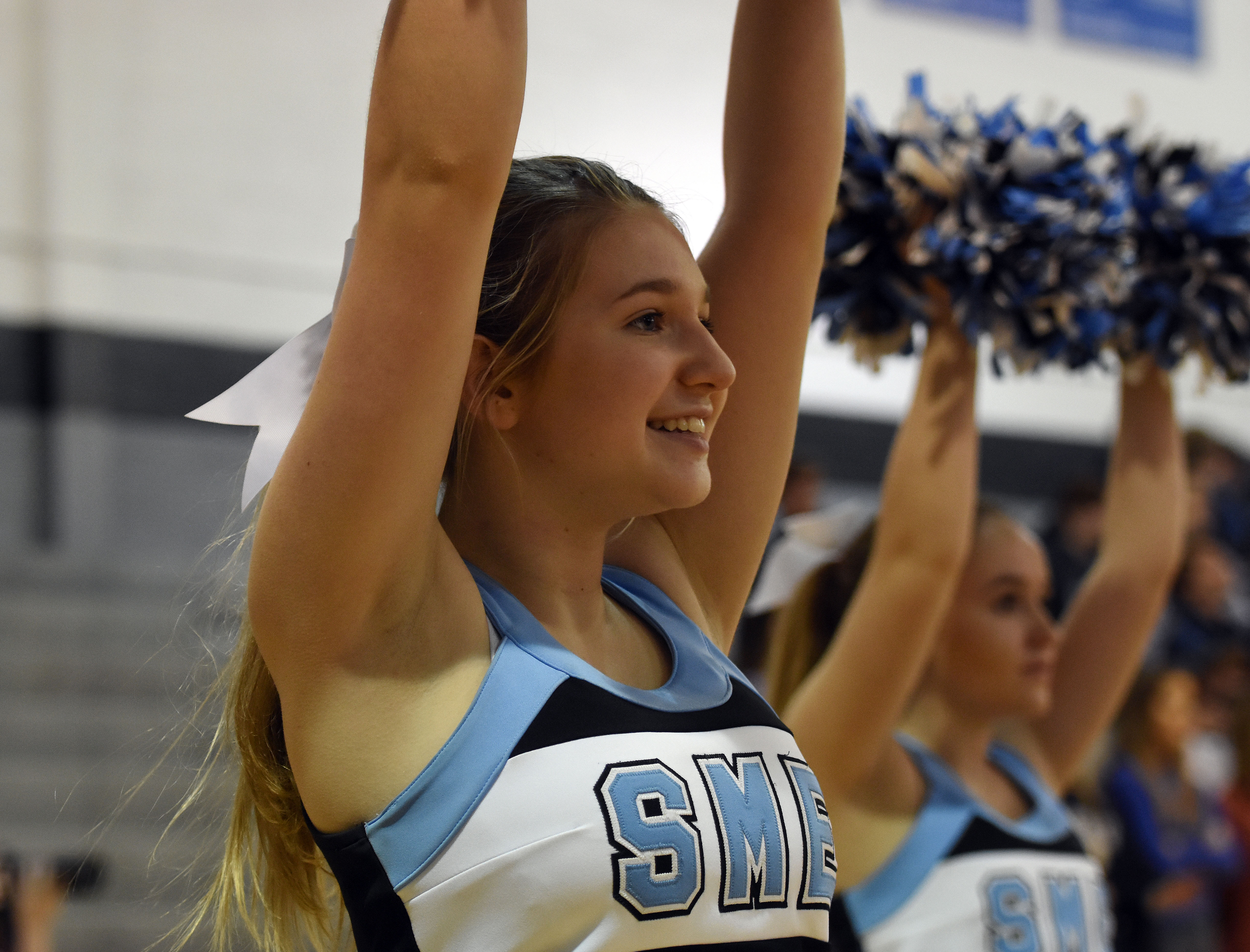 Sophomore Gabby Leinbach cheers on the sidelines of the first home ...