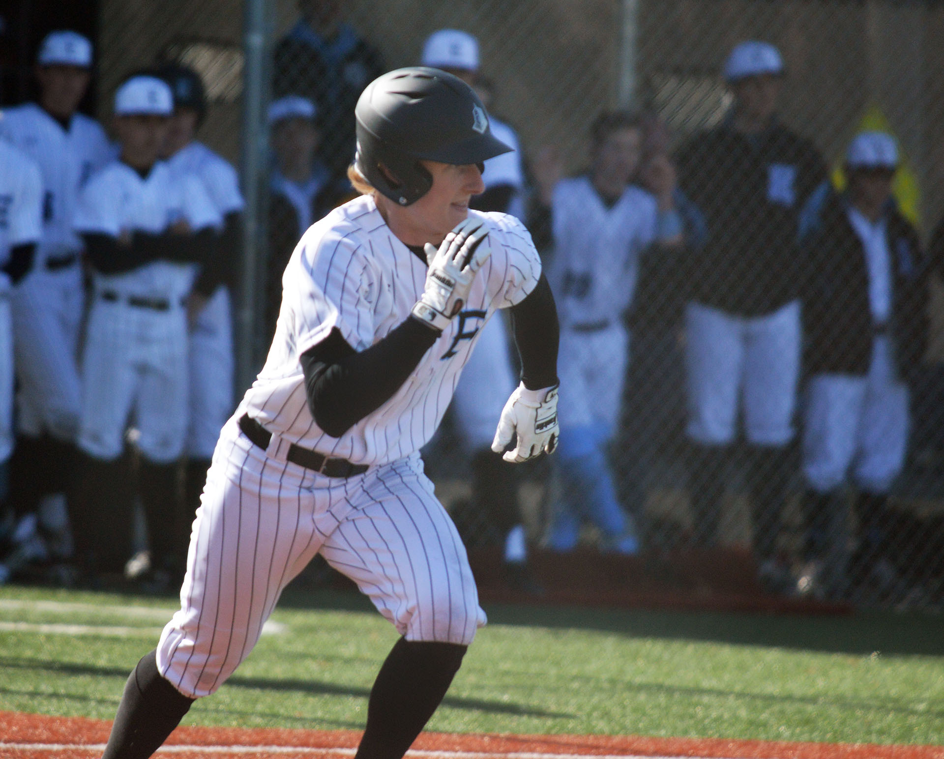 Junior Daniel Hammond runs to first base. Photo by Ally Griffith | The ...