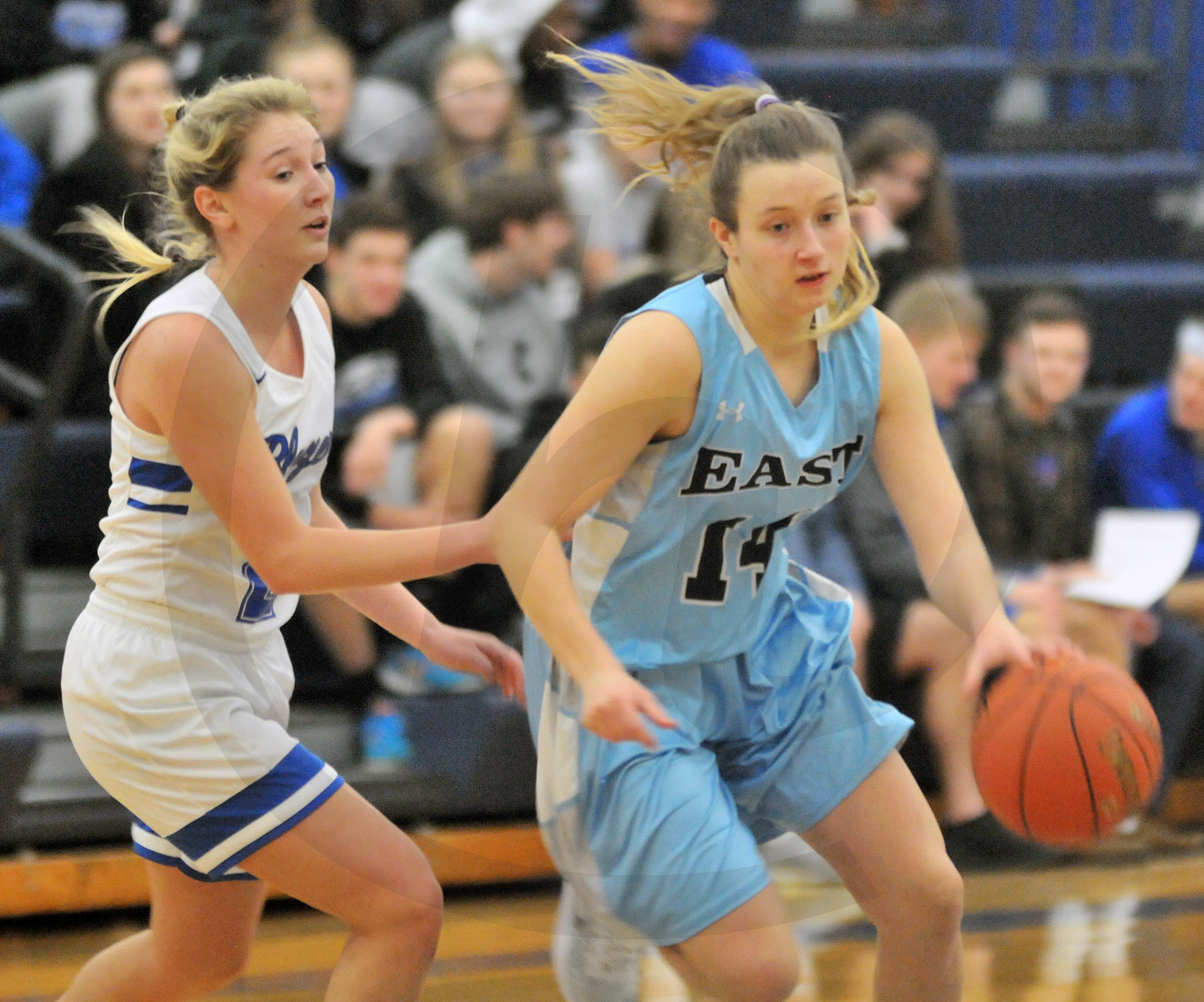 Junior Kathleen Stanley dribbles around an opponent, driving towards ...