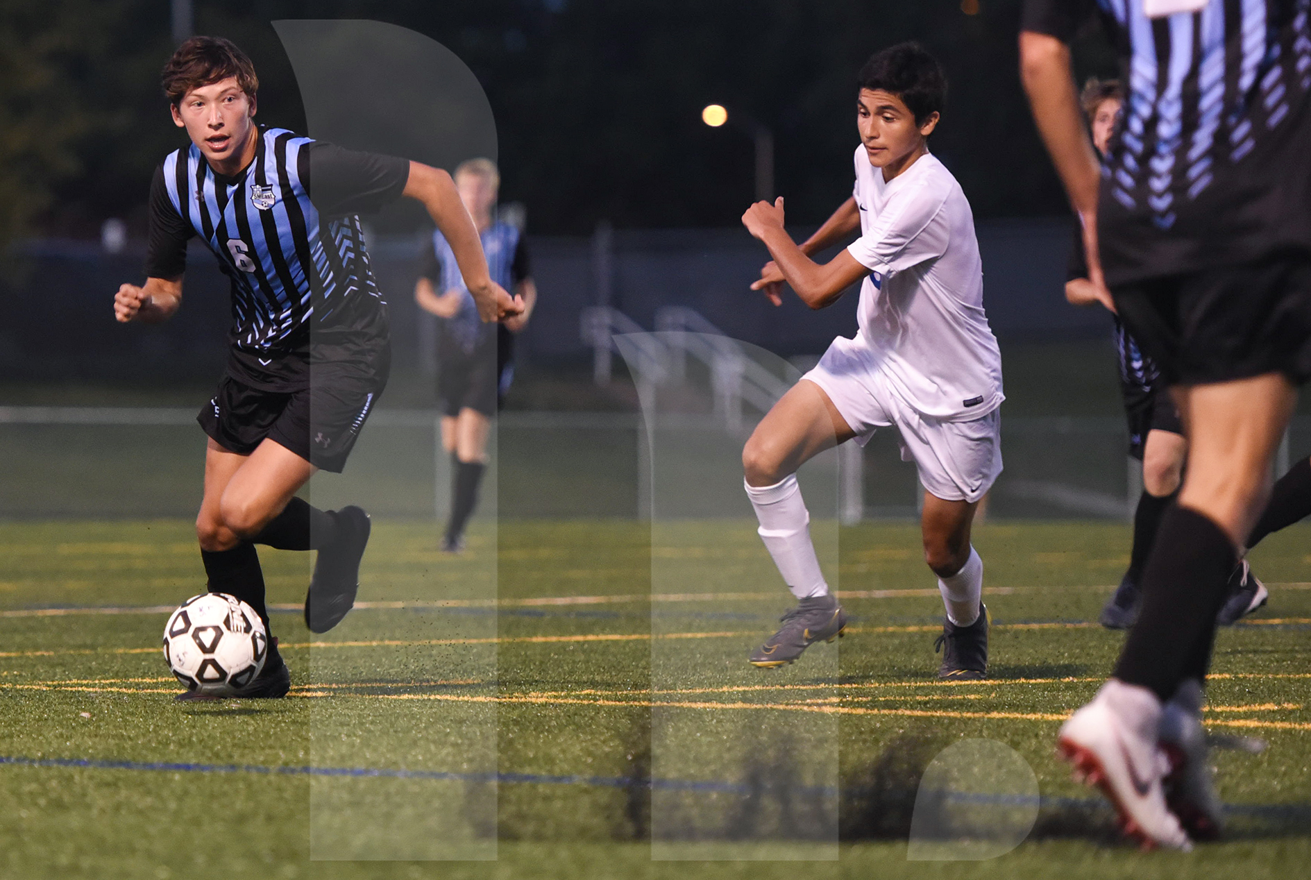 Junior Noah Brende dribbles the ball pass a Gardner player to attempt a ...