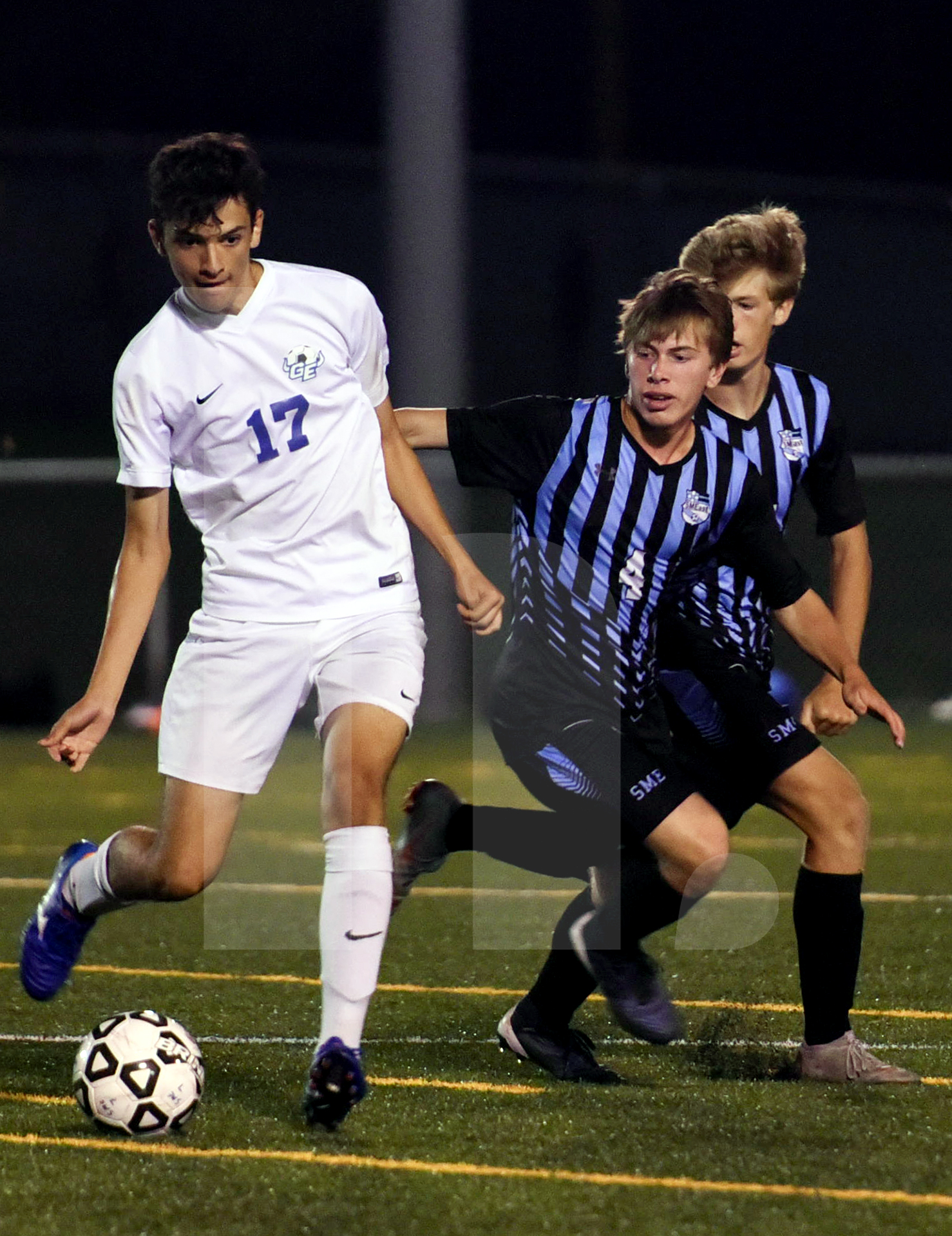 Senior Michael Venneman and Junior Mason Turpin come up behind a ...