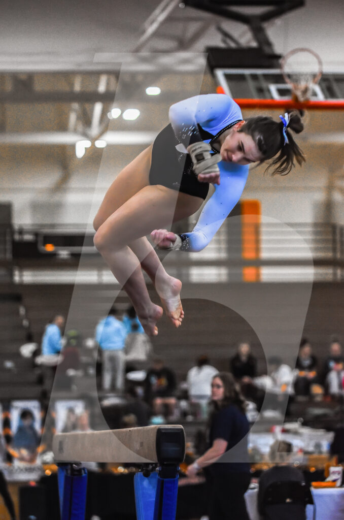 Senior Claire Rogers performs a back one and a half twist dismount on vault for the Lancer’s first event of the competition. The Lancers were in first place with a team score of 26.4 after vaulting was complete. Photo by Tyler Russell