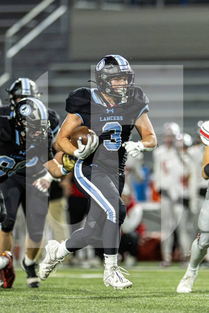 Senior Davis Eakes runs toward the end zone on a 51-yard rush in the first quarter. Eakes was tackled at the one-yard line by a Blue Valley West safety. Photo by Will Griffith
